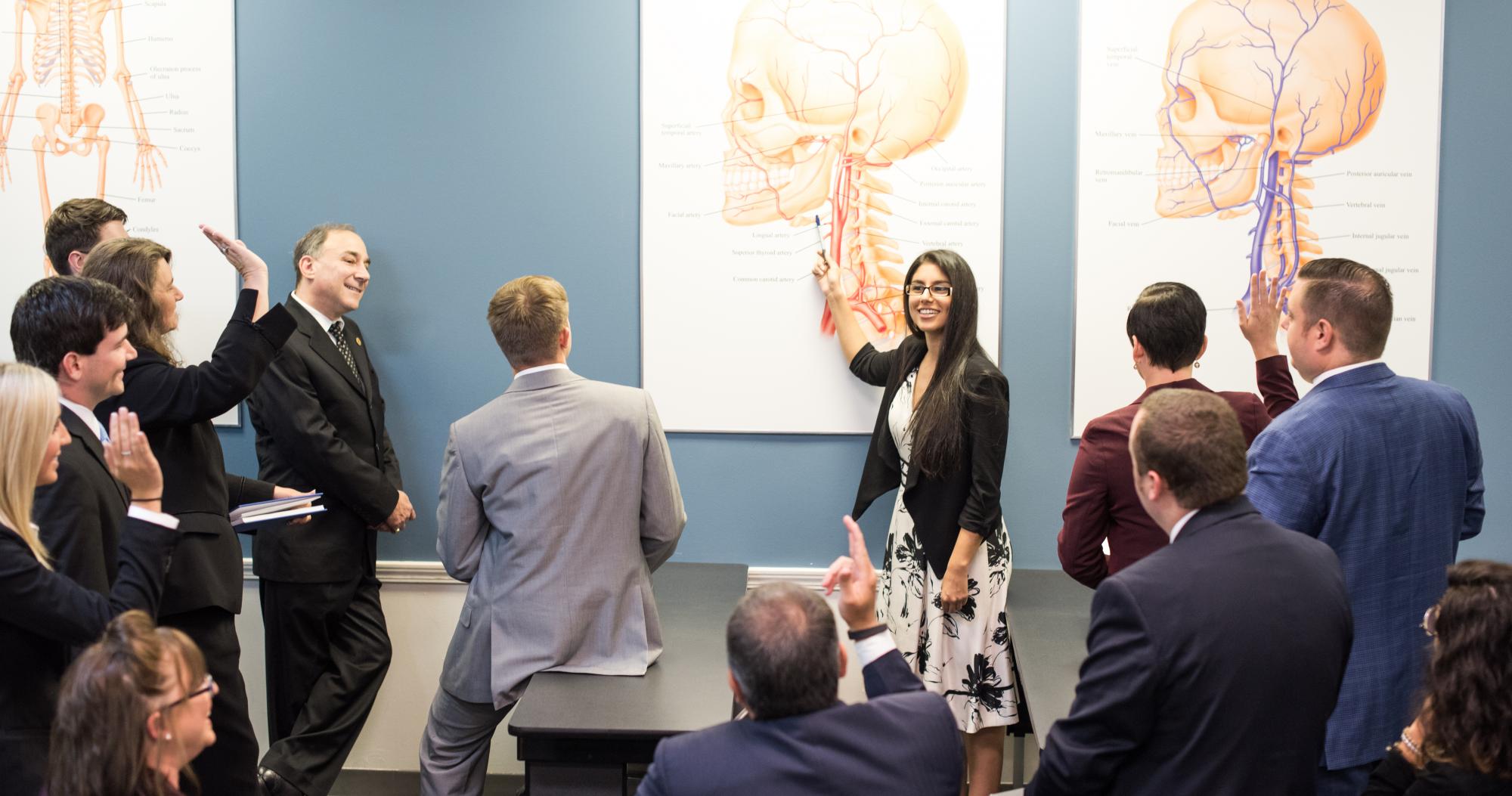 Instructor teaching anatomy to funeral service students